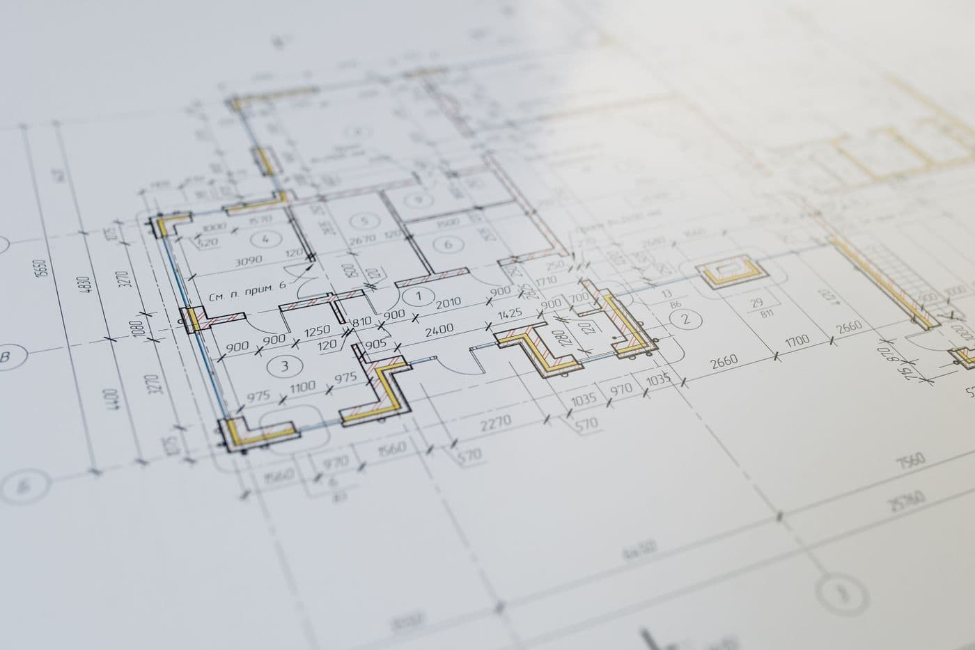 An engineer working over technical drawings